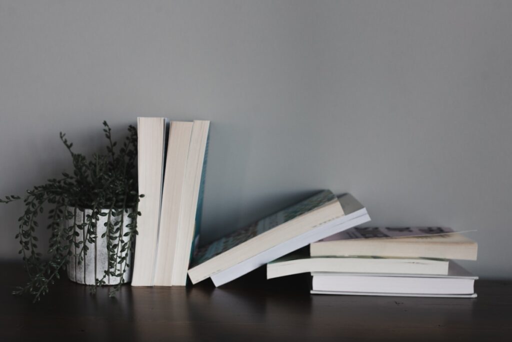 Books and manuscript in warm light
